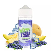 A 100ml bottle of YETI E-Liquid with Honeydew Blackcurrant flavor, surrounded by images of honeydew melon, blackcurrant berries, and ice cubes, suggesting a cool and fruity vapor experience.